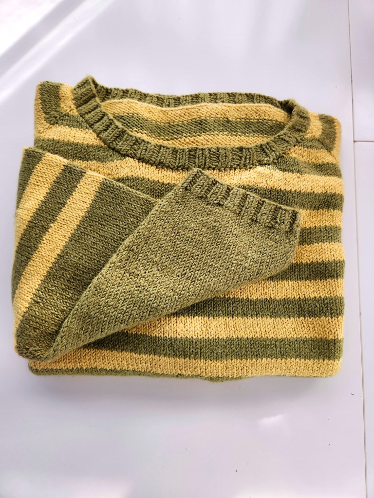 Plus sized hand knit green and yellow striped sweater