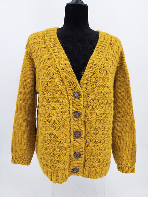 Mustard yellow knit cardigan with triangle cable design. Knit and photographed by Amazing Threads Yarn Shop.