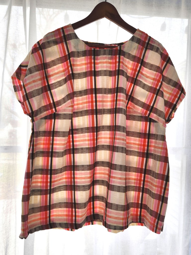 Cashmerette Montvale Tunic in a plaid patterned cotton fabric with cream, pinks, browns, and green.